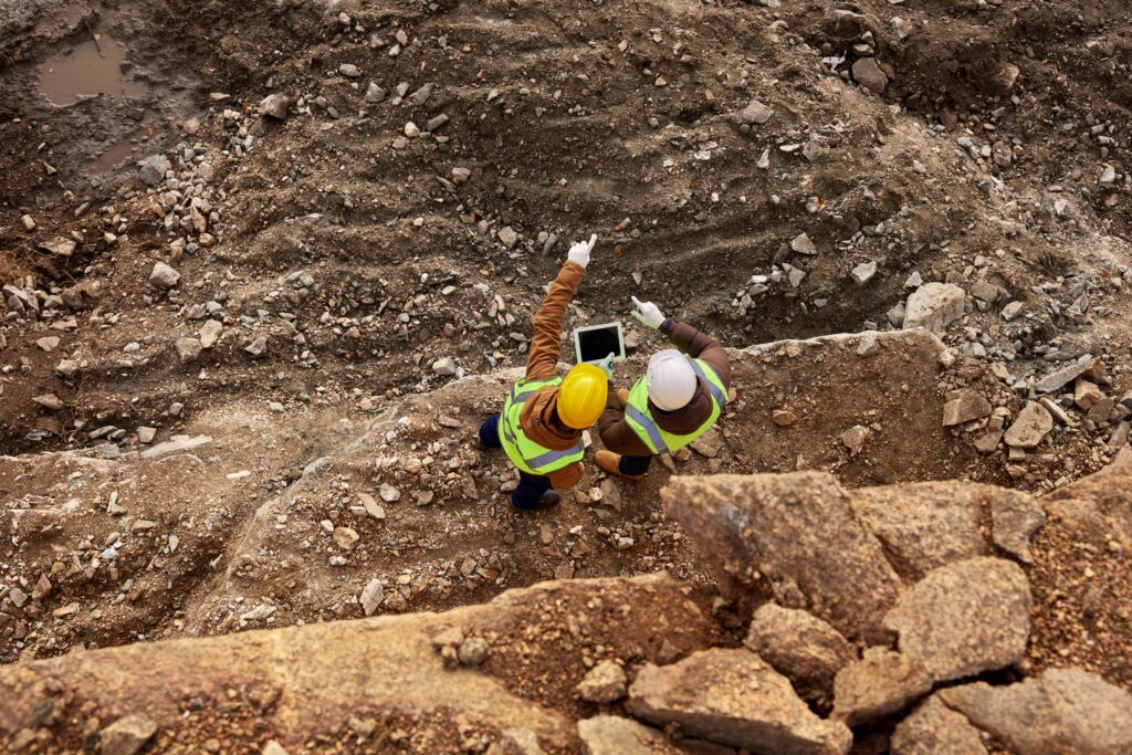Overhead picture of Two men viewing a quarry.